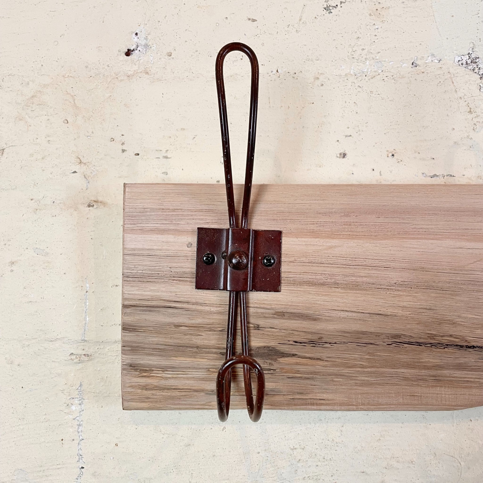 Recycled wooden coat rack with brown hooks Australia.