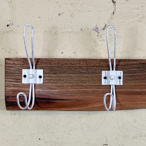 Wooden coat rack and hat rack with white hooks. Australia