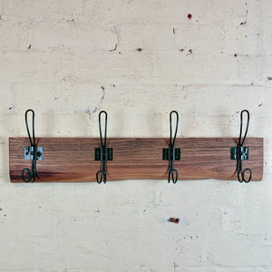 Upcycled coatrack with dark green hooks. Australia