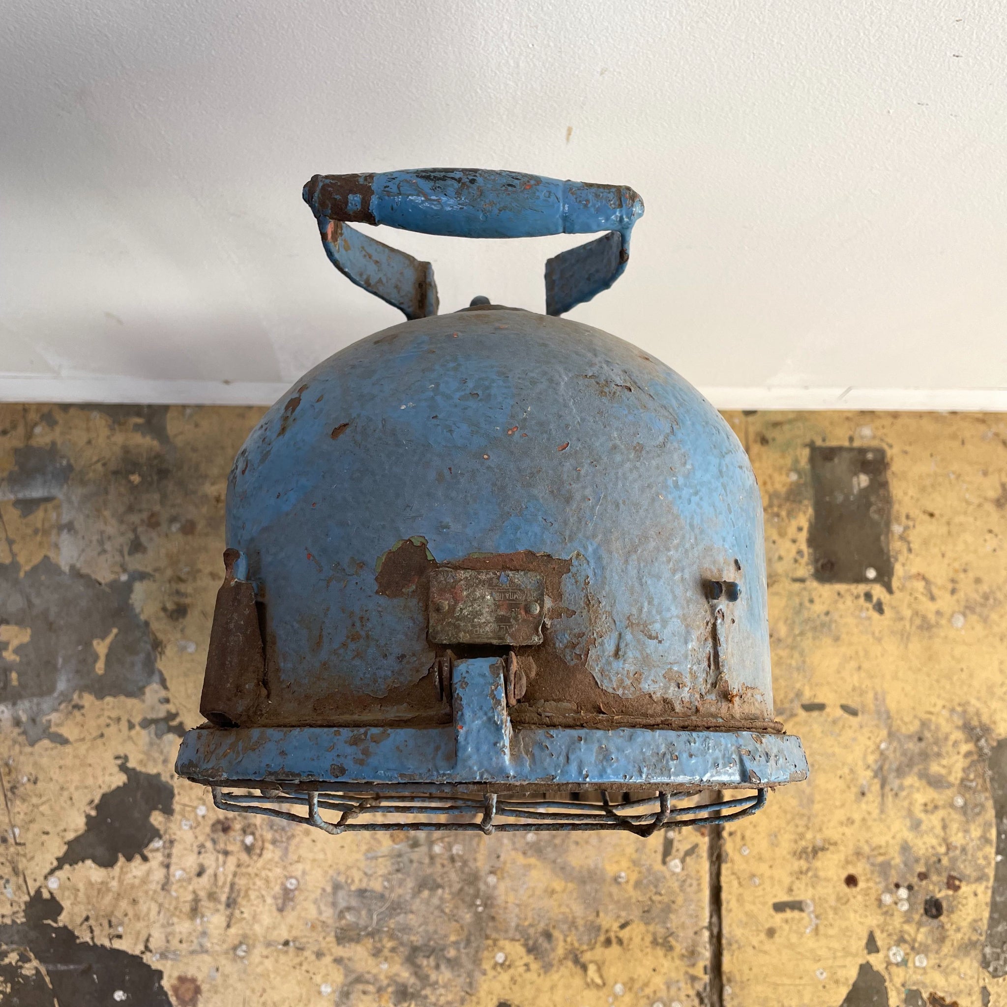 Vintage commercial light with handle, blue, outdoor lighting. 