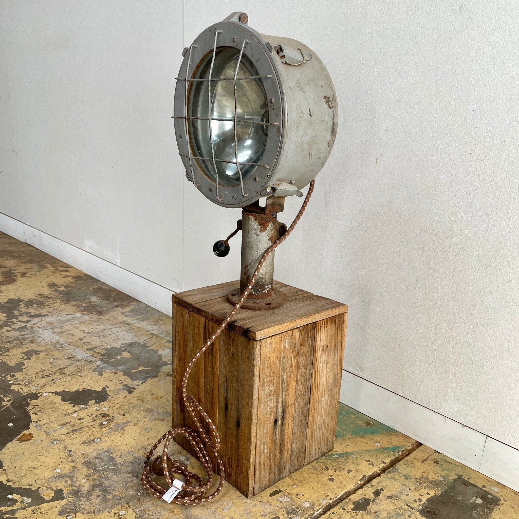 Grey vintage ship light, can be affixed to table or floor. Australia