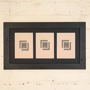 triple black picture frame with black border. 7" x 5" multi-photo frame. 