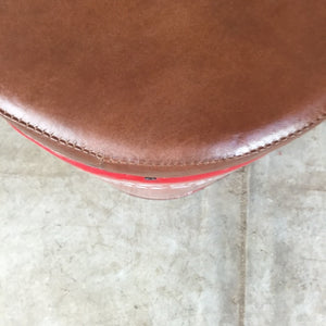 Leather top close up of drum stools for bars. Industrial style low stools Australia. 