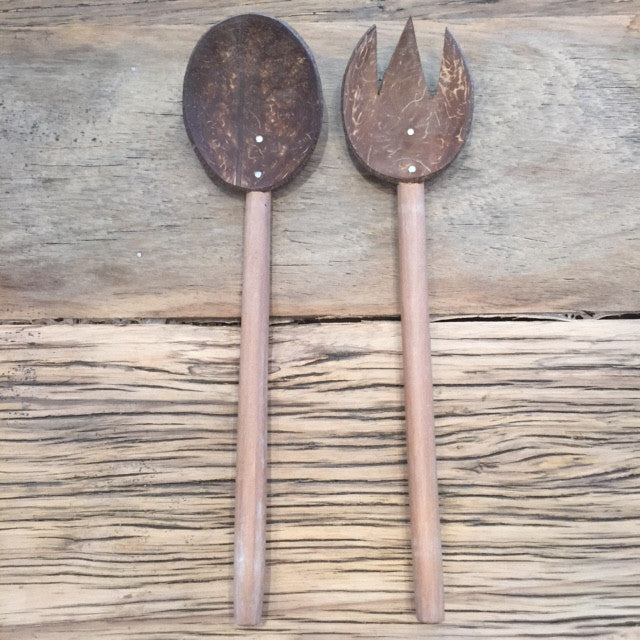 Eco friendly salad serving spoons light and dark brown smooth finish. Different looking wooden spoons. 