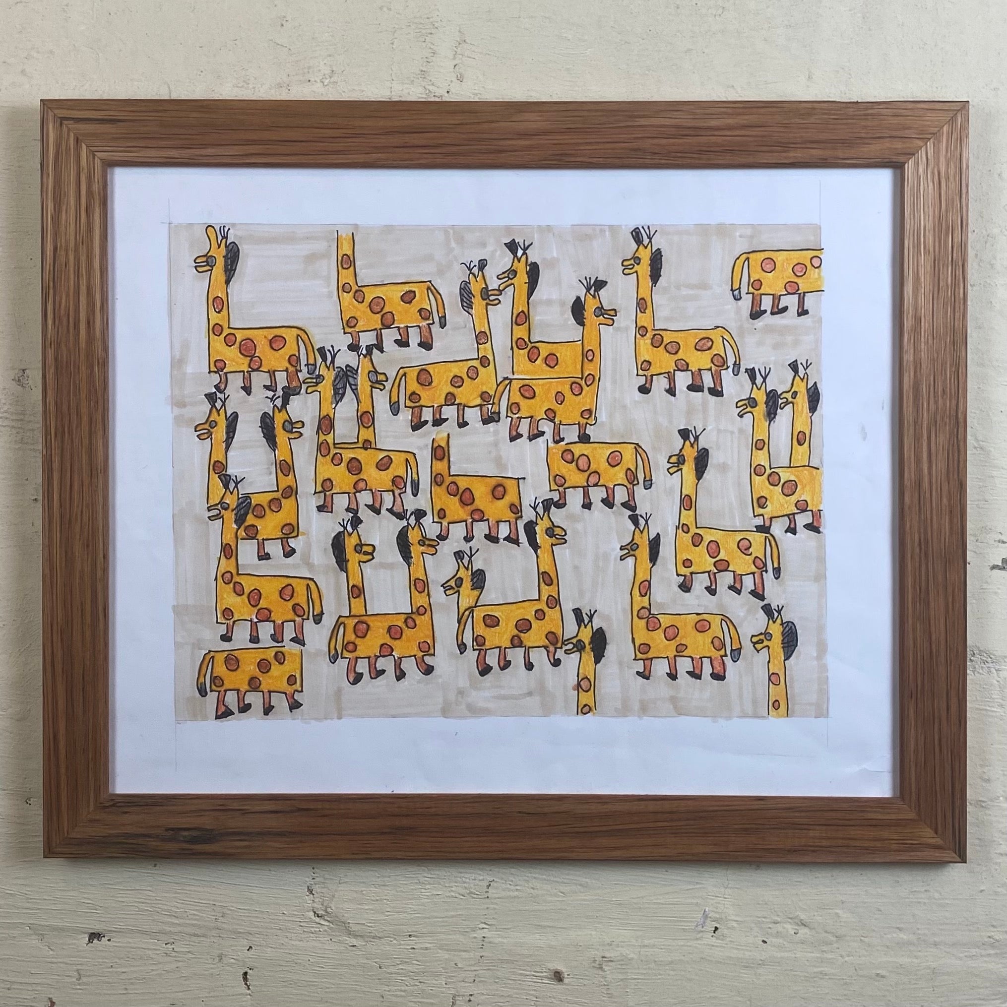 Medium brown upcycled wooden photo frame with white mat board and child's drawing of giraffes. 