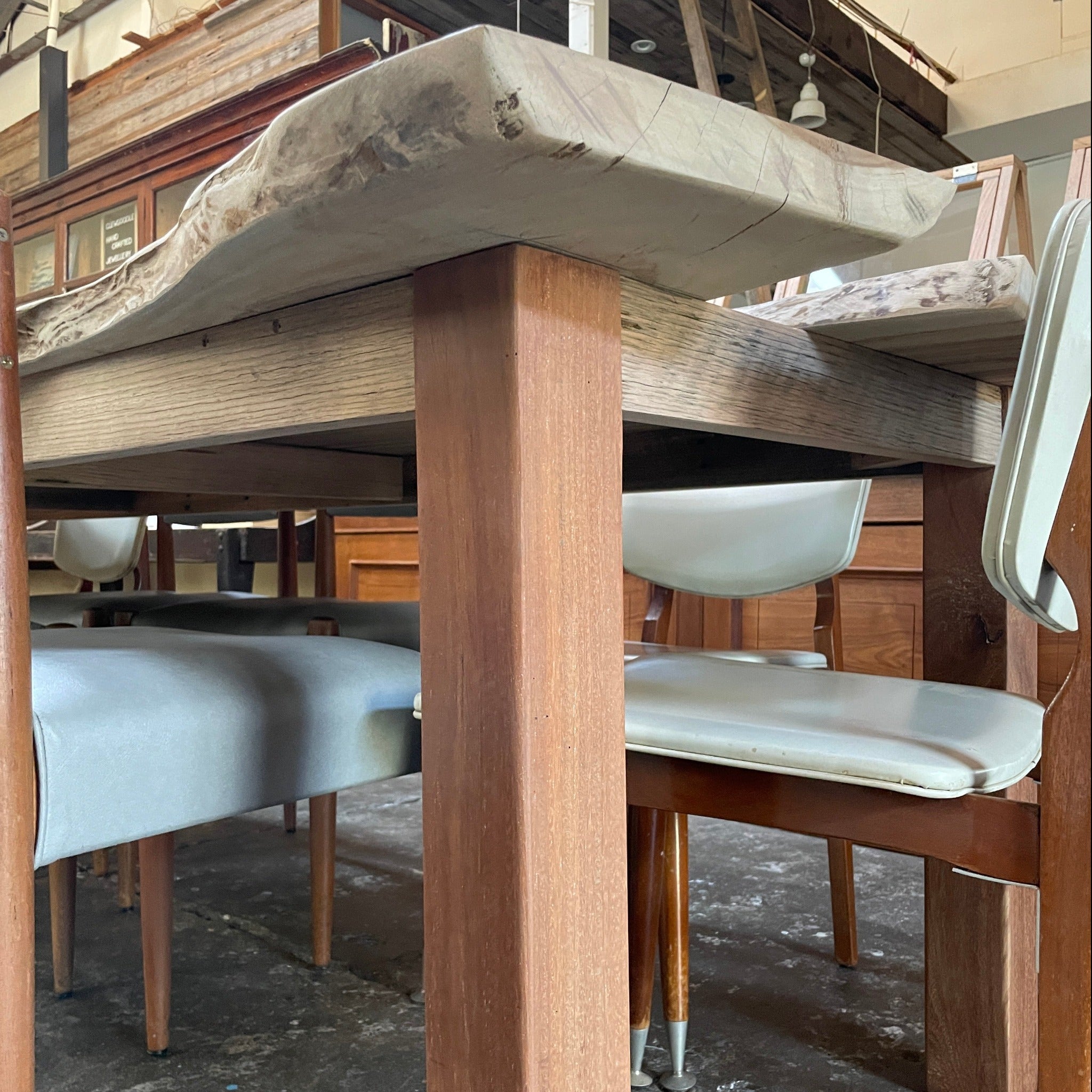 Hardwood table base under thick timber slab of Camphor Laurel timber. 