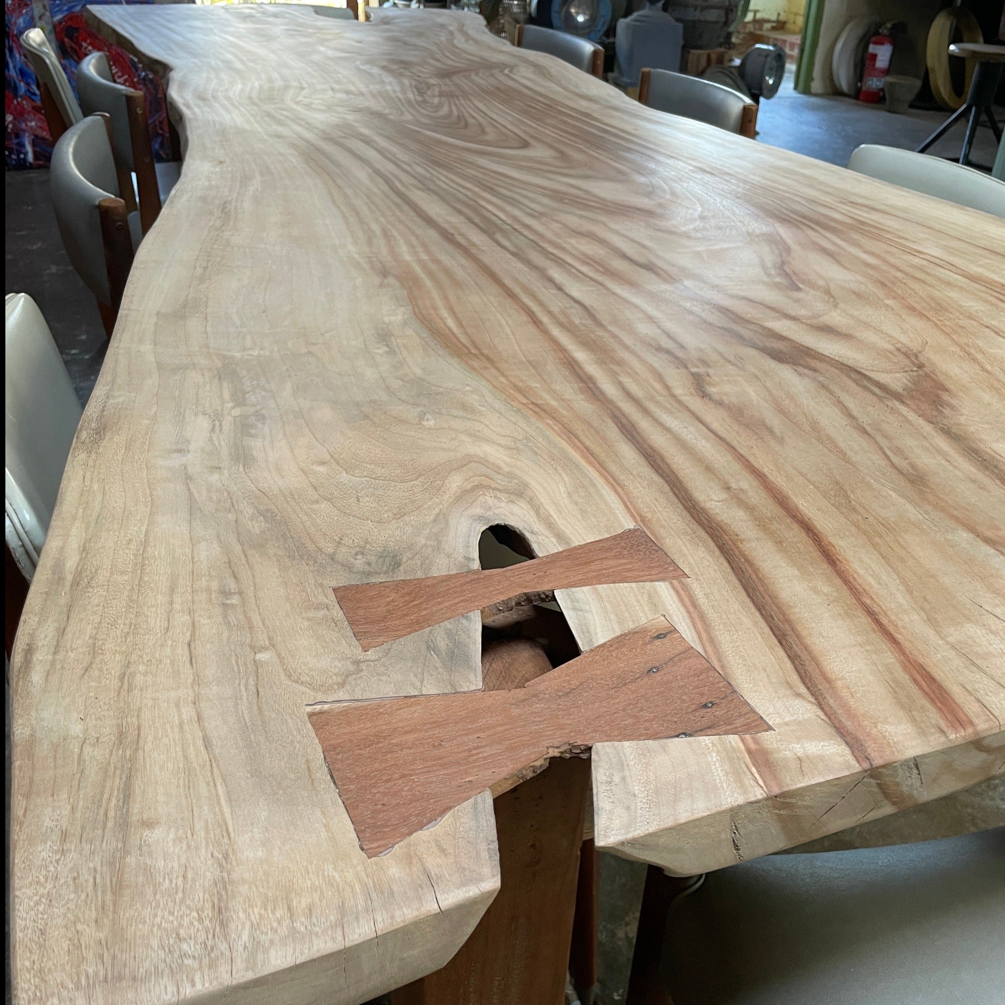 Rustic hardwood dining table with butterfly joins. 