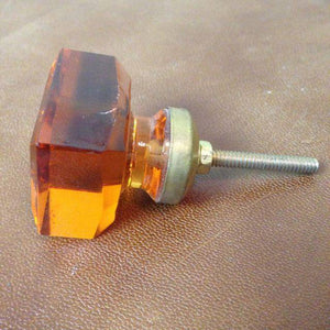 Amber orange coloured cabinet knobs. 