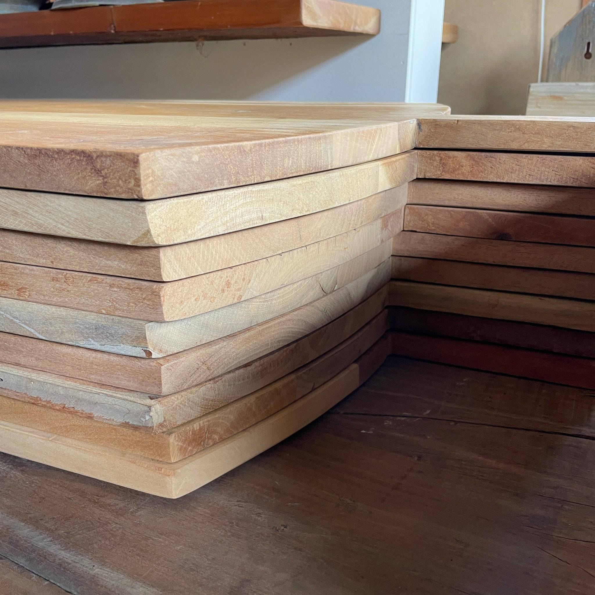 A stack of recycled wooden serving boards in Australia