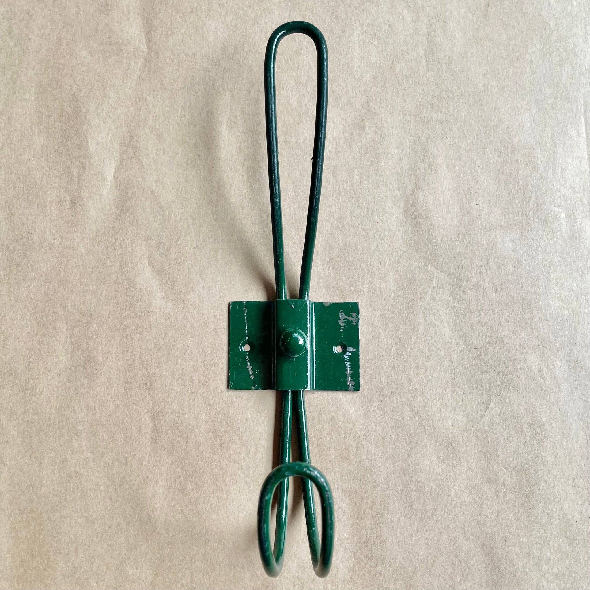 Dark brown, strong wall hooks for jackets and coats. 