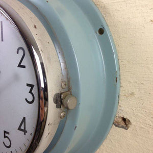 Rusty blue metal citizrn clock with metal frame. 