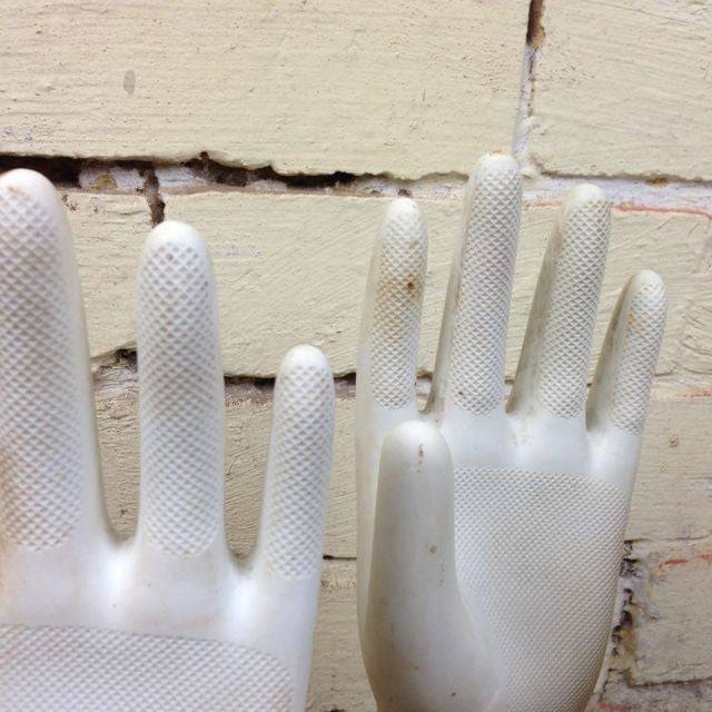 Vlose up of white vintage glove mould with grip. 
