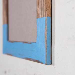 photo frames melbourne. Side on photo of Blue and Dark timber picture frame. 