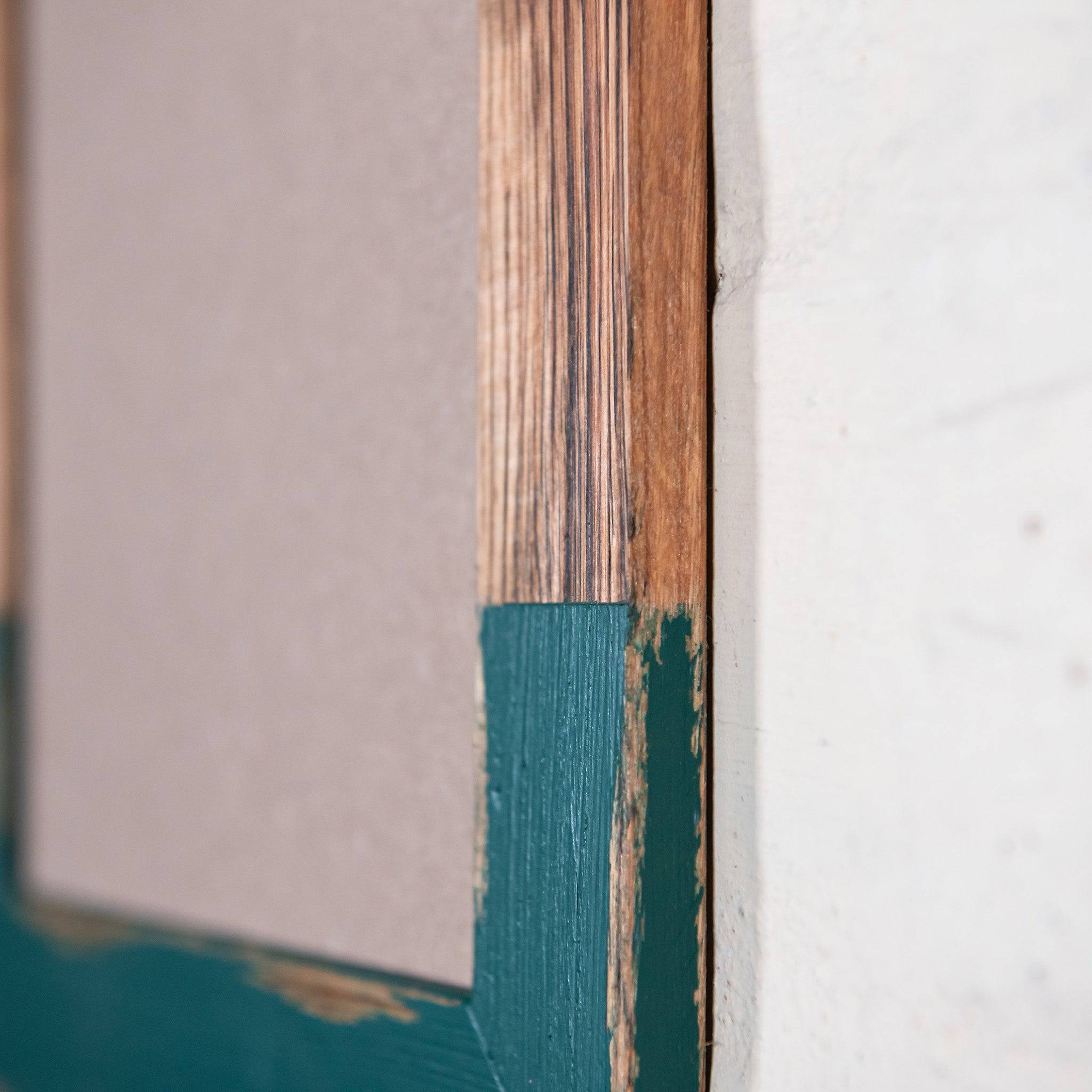 Side on photo of dark brown timber photo frame with green paint. Create own photo frame