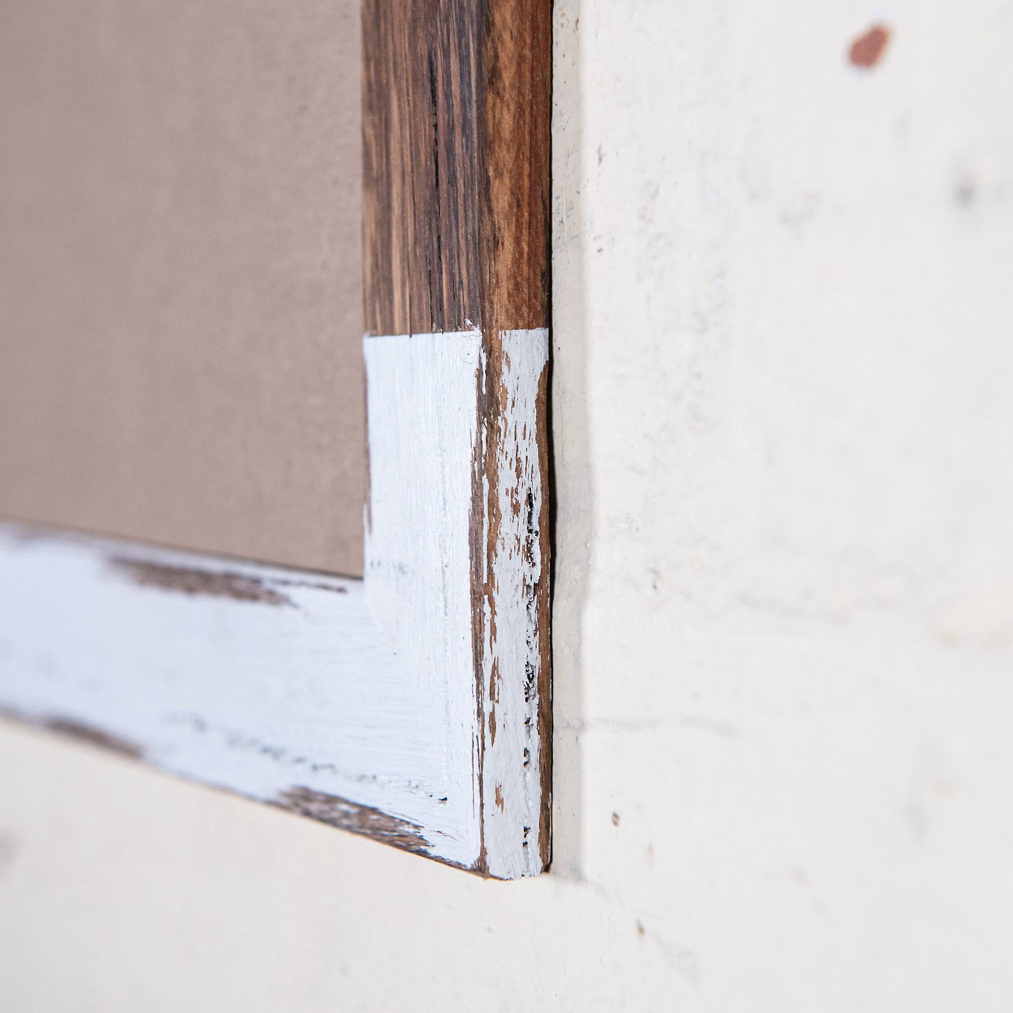 Side shot of two tone multi-coloured picture frame, made from recycled timber. 