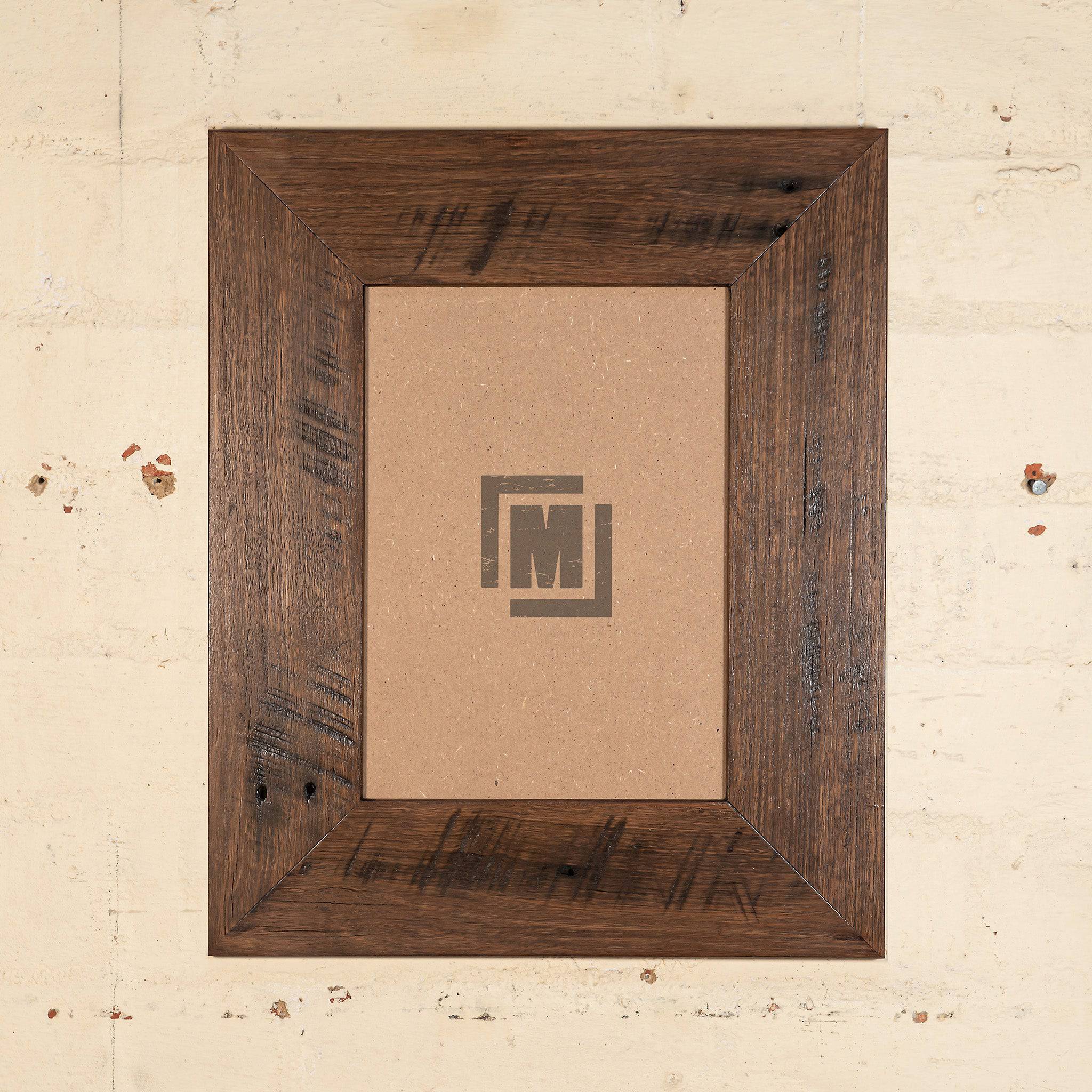Dark stained timber photo frame to suit an A4 image, made form recycled wood. 