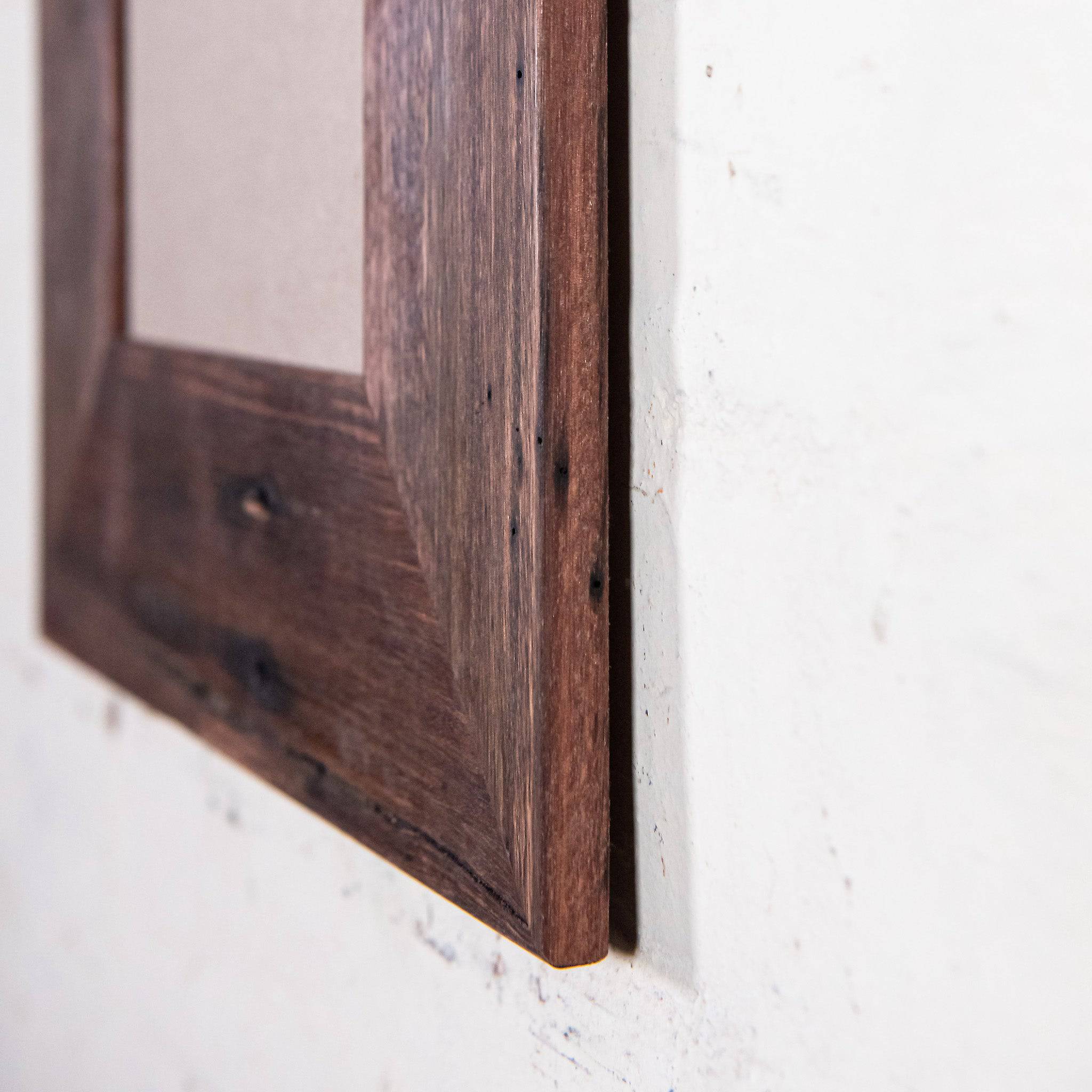 Side on shot of Wide reclaimed timber photo frame for A4 size image. Vertical picture frame. 