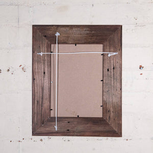 Back of weatherboard photo frame showing string to hang portrait or landscape. 