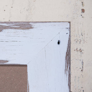 Close up of corner of white wood picture frame, weatherboard photo frames. 